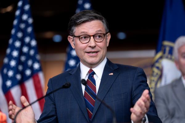 Speaker of the House Mike Johnson, R-La., in a suit and tie, speaking at the Capitol in Washington on July 23, 2024